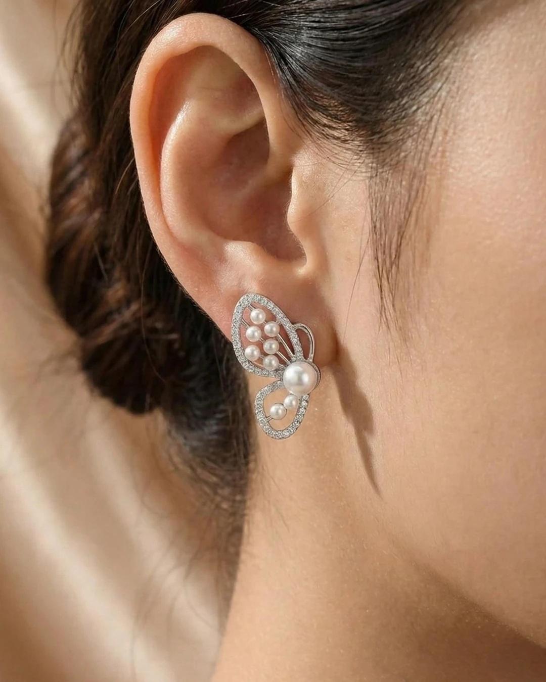 Graceful Butterfly Pearl Stud Earrings – 925 Sterling Silver - model