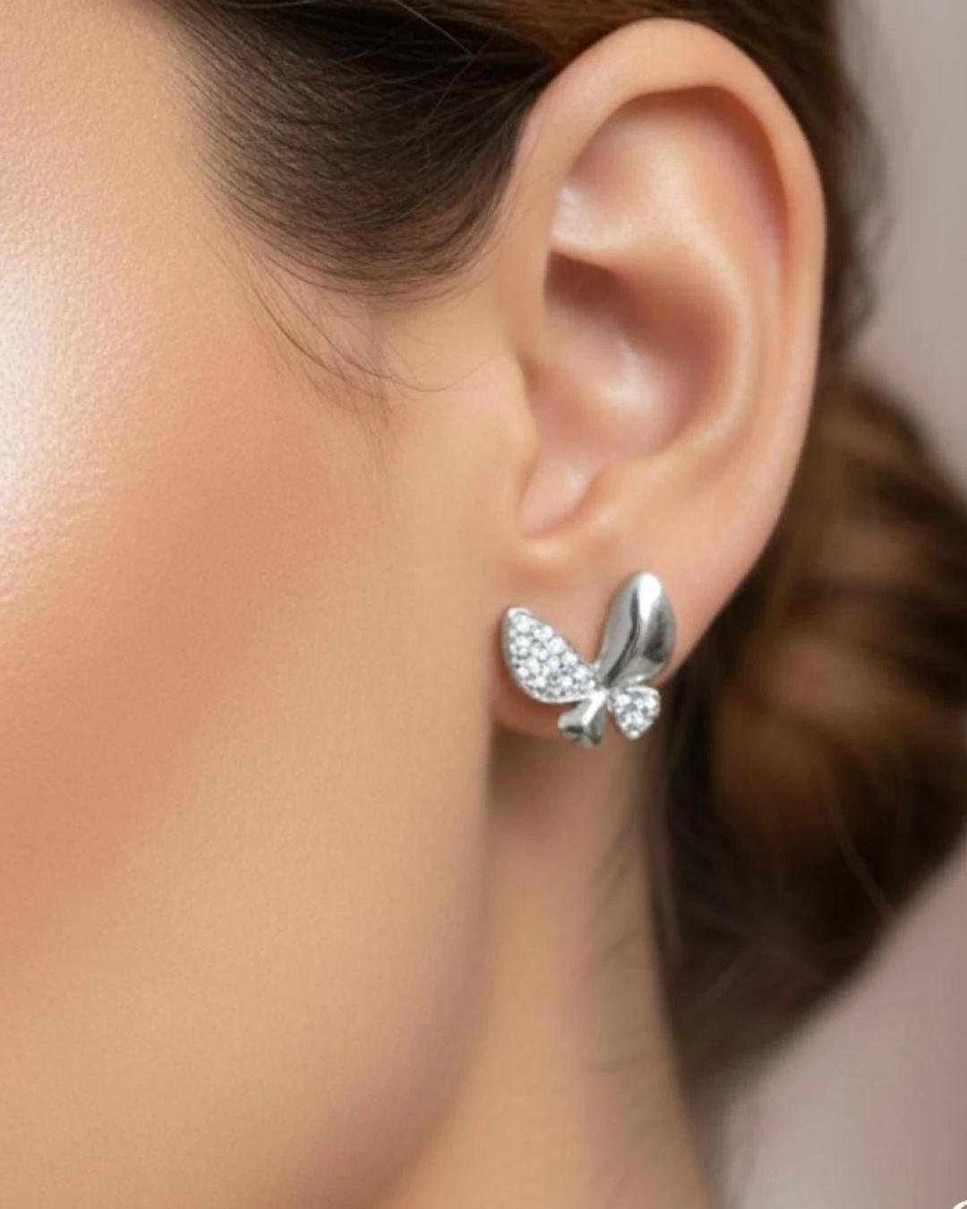 Whimsical Butterfly Pavé Stud Earrings – 925 Sterling Silver - model