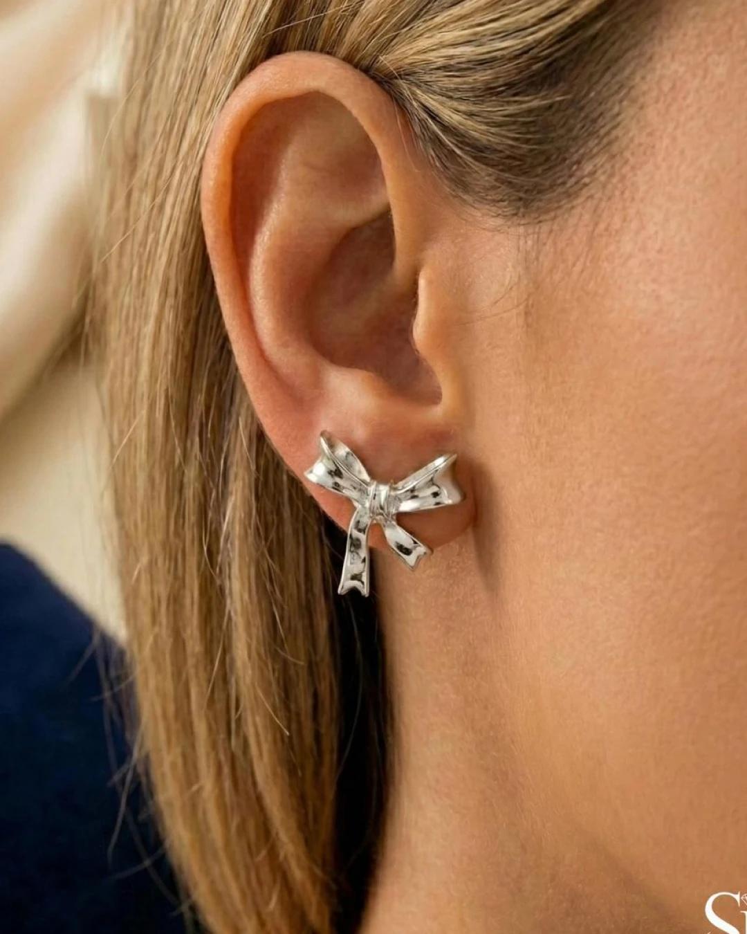 Polished Ribbon Bow Stud Earrings – 925 Sterling Silver - model